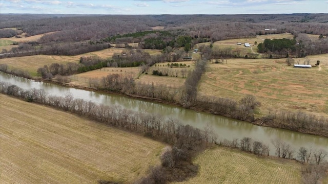 birds eye view of property featuring a water view and a rural view