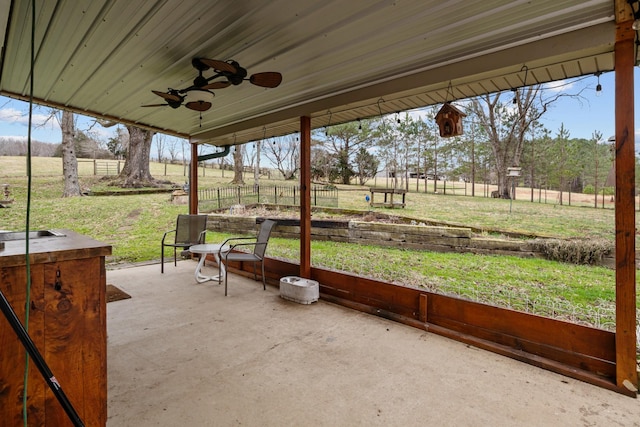 view of patio featuring sink, a rural view, and ceiling fan