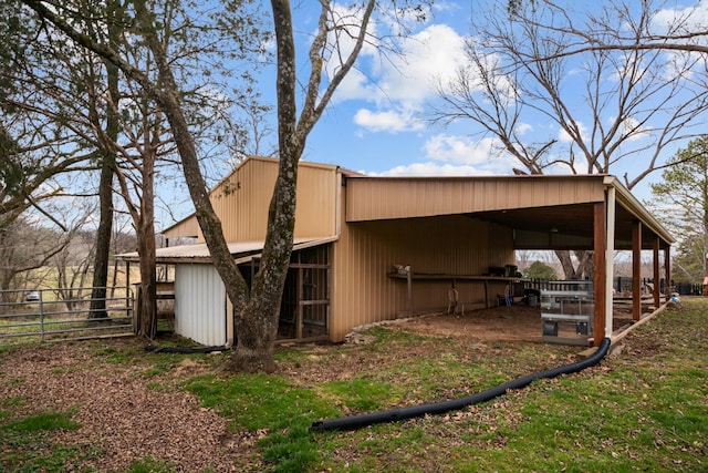 view of side of home with an outdoor structure