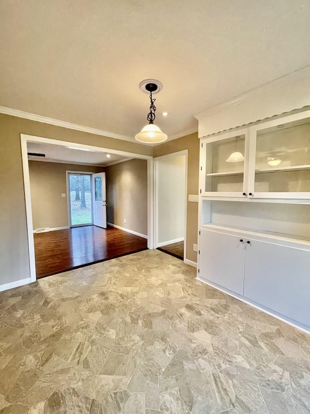 spare room featuring ornamental molding