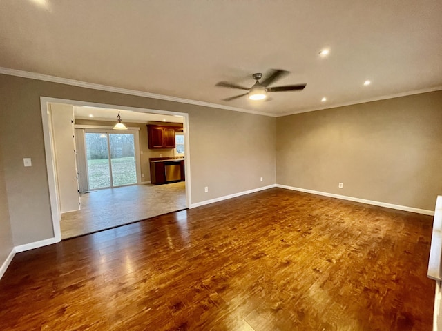 unfurnished room featuring hardwood / wood-style floors, ornamental molding, and ceiling fan