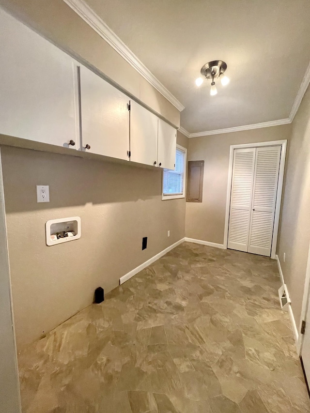 clothes washing area featuring cabinets, washer hookup, and ornamental molding