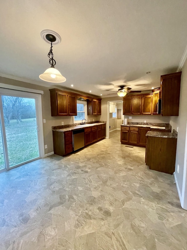 kitchen with decorative light fixtures, sink, ornamental molding, ceiling fan, and stainless steel appliances