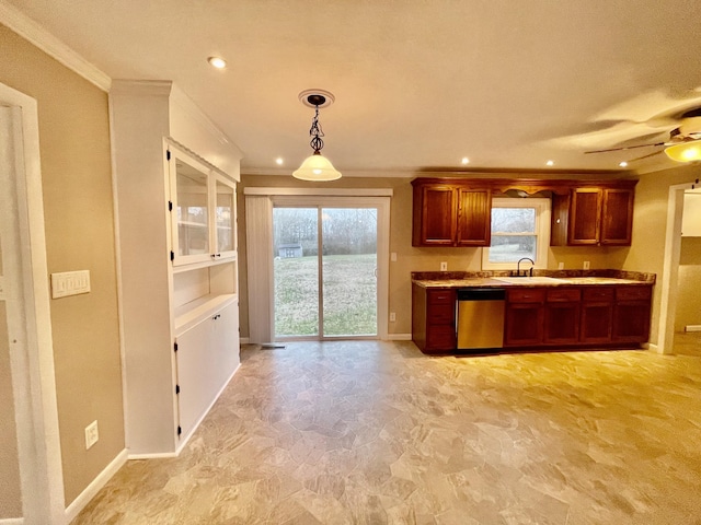 kitchen with dishwasher, sink, ornamental molding, and decorative light fixtures