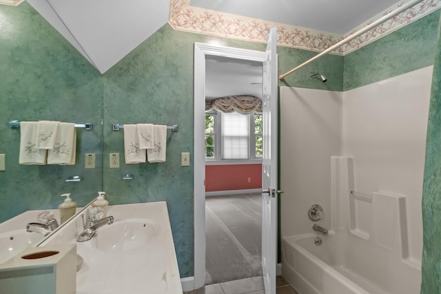bathroom with vanity and bathing tub / shower combination