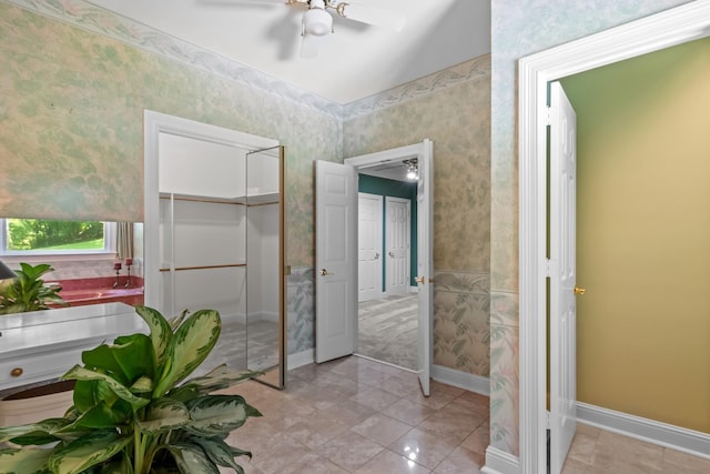 bathroom with tile patterned floors and ceiling fan