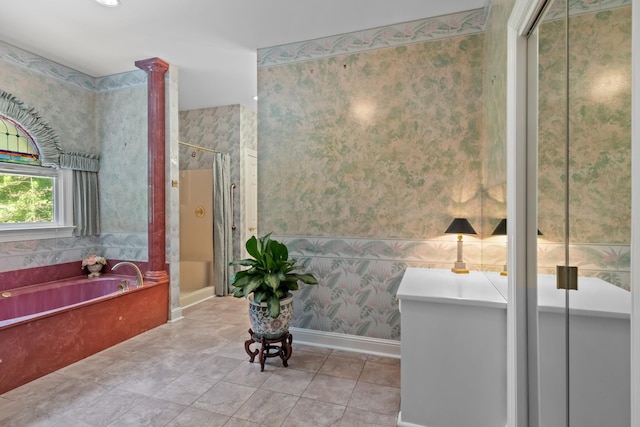 bathroom with ornate columns, plus walk in shower, and tile patterned flooring
