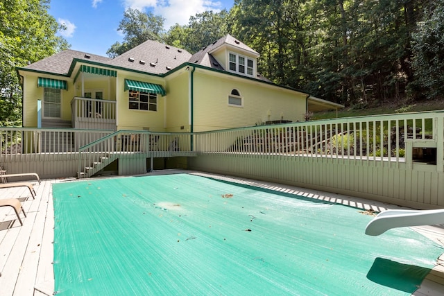 view of swimming pool with a wooden deck
