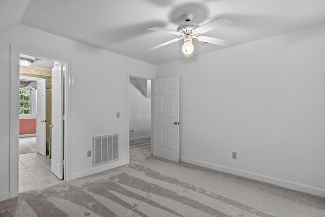 carpeted empty room with ceiling fan