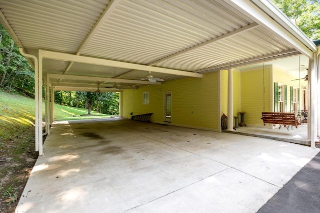 view of patio featuring a carport and ceiling fan
