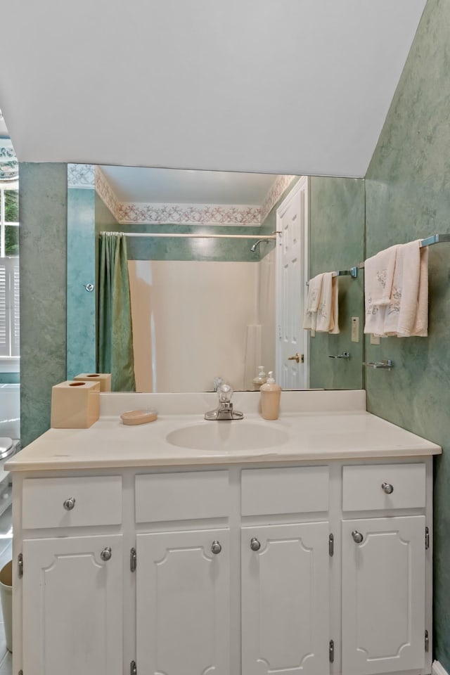 bathroom with vanity, toilet, and a shower with shower curtain