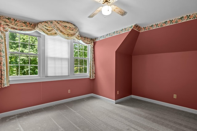 bonus room featuring lofted ceiling, ceiling fan, and carpet flooring