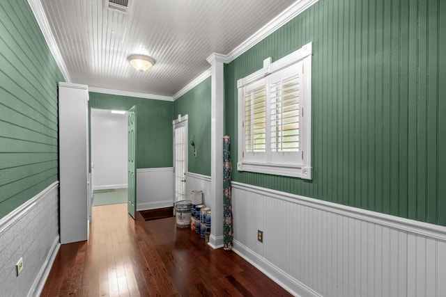 interior space featuring ornamental molding and dark hardwood / wood-style floors