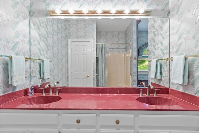 bathroom with walk in shower and vanity