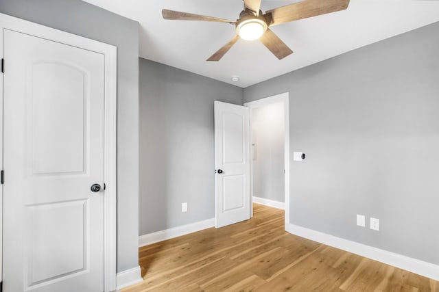 unfurnished bedroom featuring light hardwood / wood-style floors and ceiling fan