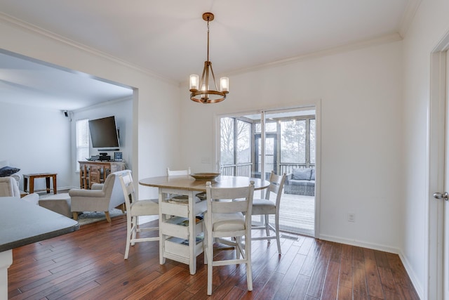 dining room with dark wood-type flooring, a chandelier, and a wealth of natural light