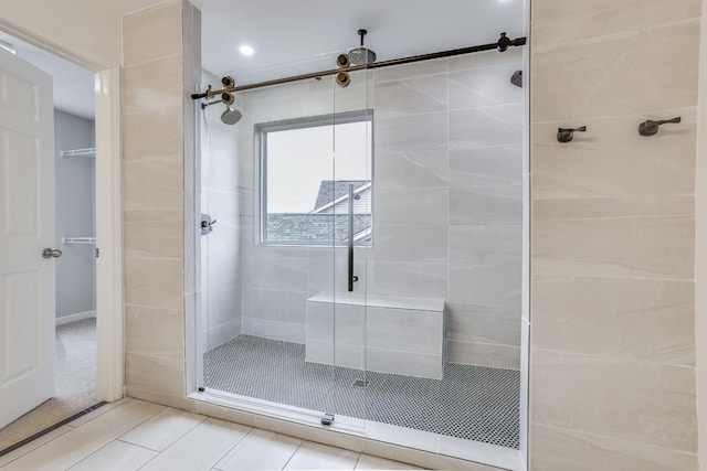 bathroom featuring a shower with shower door