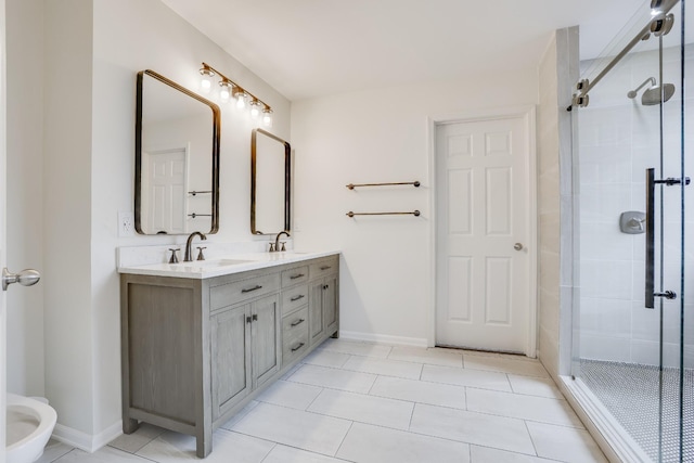 bathroom with walk in shower, vanity, and tile patterned flooring