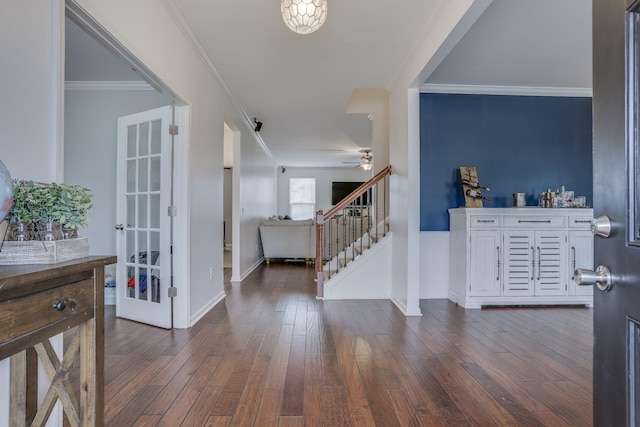 entryway featuring ornamental molding and dark hardwood / wood-style flooring