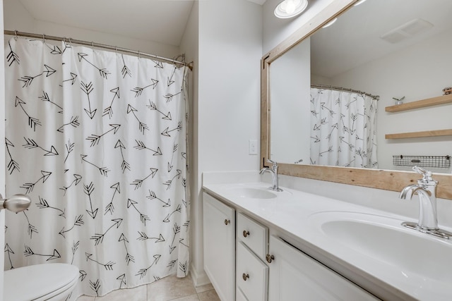 bathroom with vanity, tile patterned flooring, a shower with curtain, and toilet