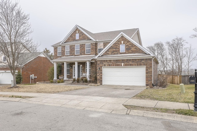 view of front of home featuring a garage and covered porch