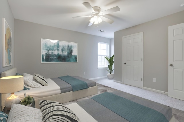 bedroom featuring light carpet and ceiling fan