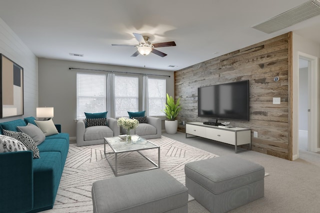 living room featuring ceiling fan and light carpet