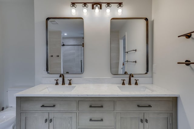 bathroom featuring vanity, toilet, and a shower