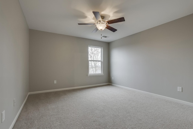 spare room with ceiling fan and carpet floors