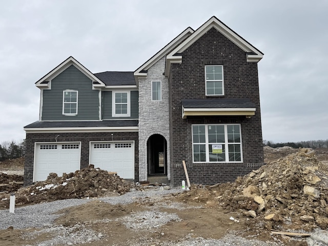 view of front of property with a garage