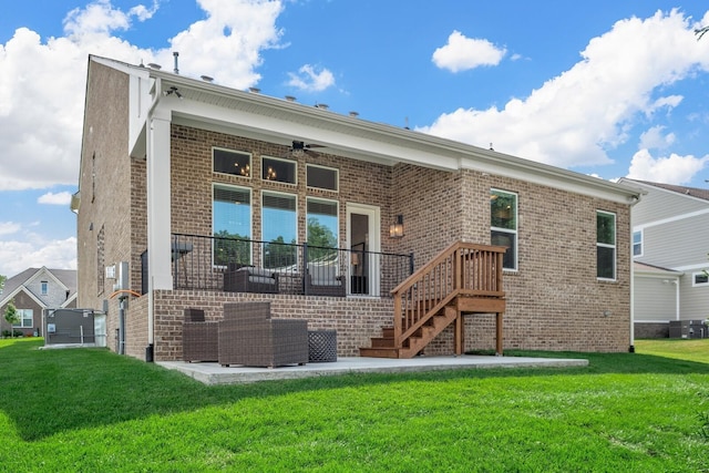 rear view of house with ceiling fan, a yard, a patio, central air condition unit, and an outdoor hangout area