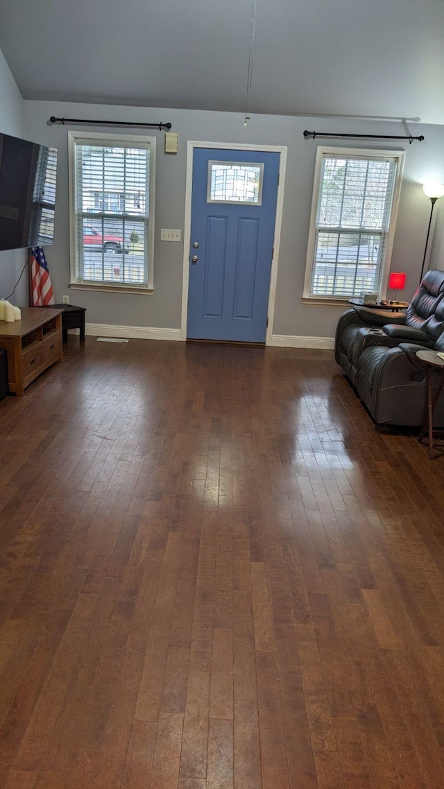 foyer entrance featuring dark hardwood / wood-style floors