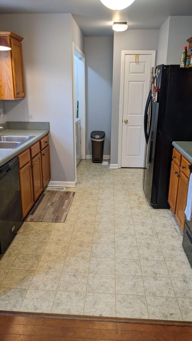 kitchen with sink and black appliances