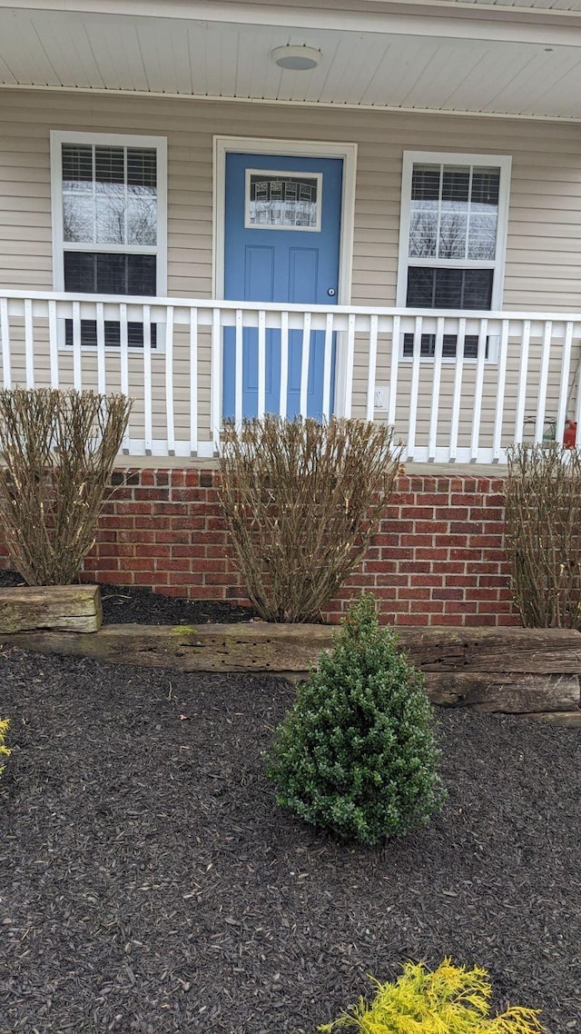 property entrance with a porch