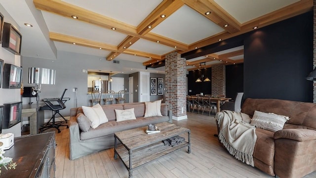 living room with ornate columns, coffered ceiling, light hardwood / wood-style flooring, and beamed ceiling