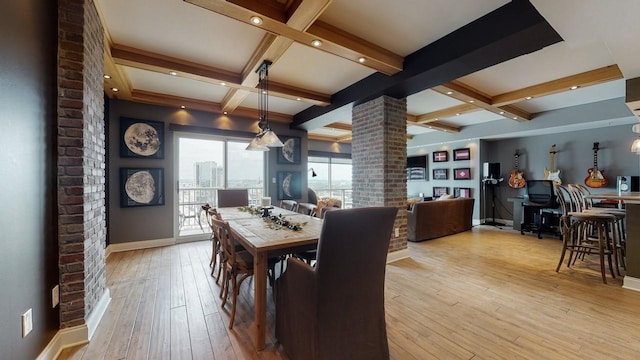 dining space featuring ornate columns, coffered ceiling, light hardwood / wood-style floors, and beam ceiling