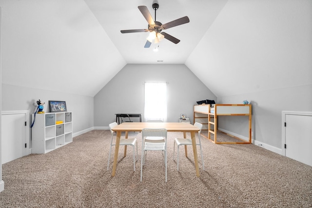 office area featuring vaulted ceiling, ceiling fan, and carpet