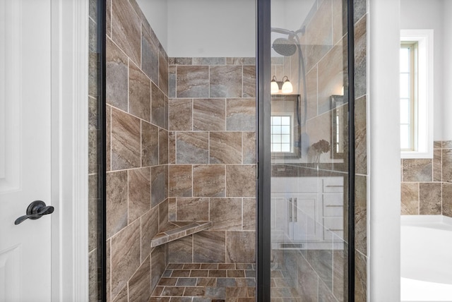 bathroom with shower with separate bathtub