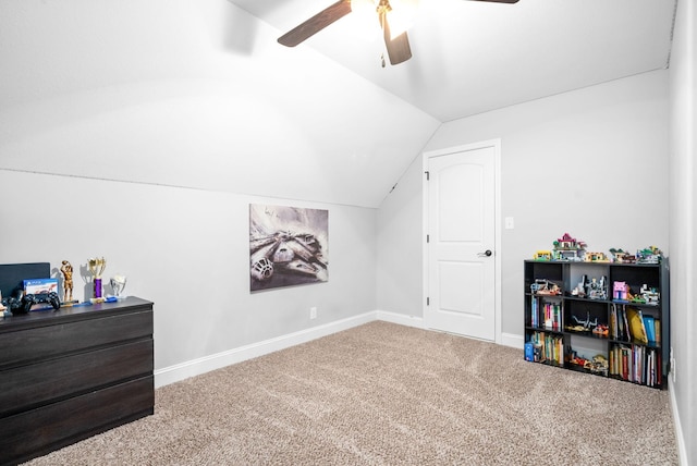 interior space featuring lofted ceiling, carpet floors, and ceiling fan