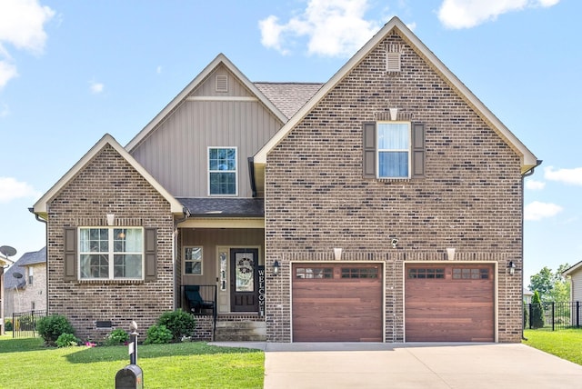 view of front of property with a garage and a front lawn