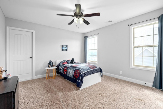 carpeted bedroom with ceiling fan