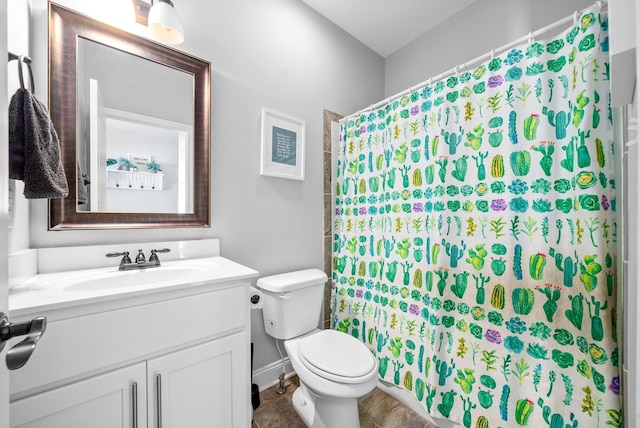 bathroom with a shower with curtain, vanity, and toilet