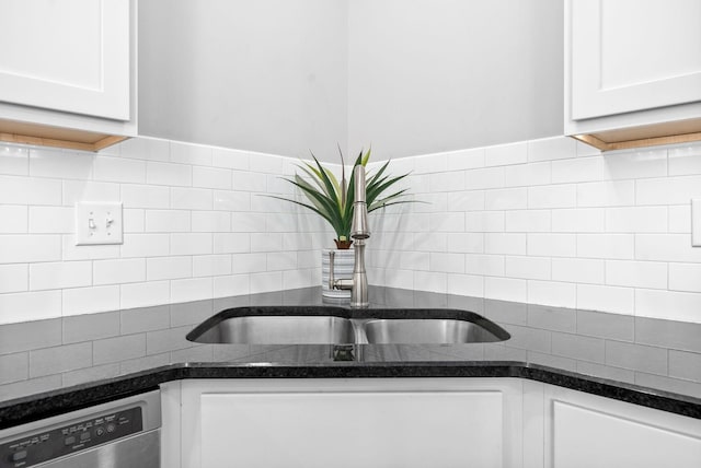 kitchen featuring white cabinetry, dishwasher, and sink