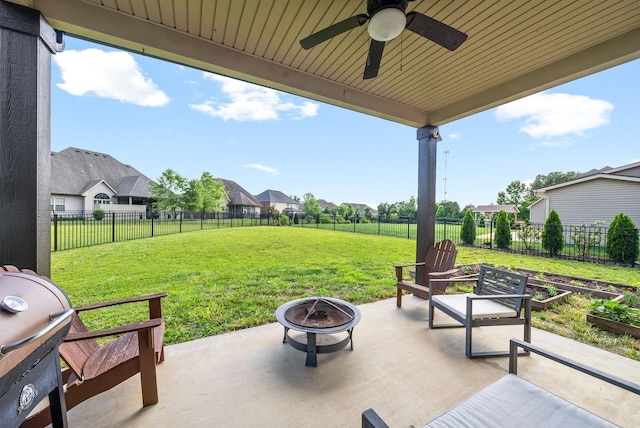 view of patio / terrace featuring area for grilling, ceiling fan, and an outdoor fire pit