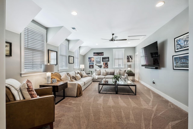 carpeted living room featuring vaulted ceiling and ceiling fan