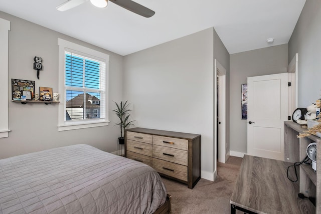 bedroom featuring ceiling fan and carpet