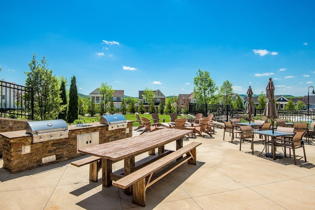 view of patio with exterior kitchen and area for grilling