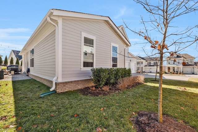 view of home's exterior featuring a yard