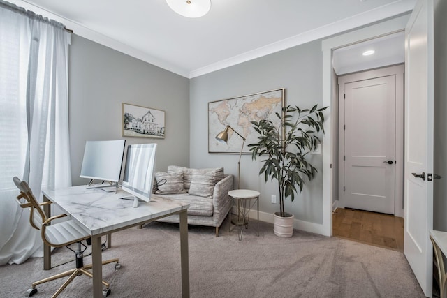 office space featuring light colored carpet and ornamental molding