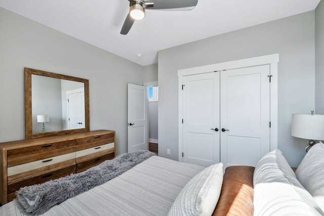 bedroom with ceiling fan and a closet